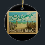 Madeira Beach Vintage Travel Ceramic Ornament<br><div class="desc">This Greetings From Madeira Beach vintage postcard design features a sandy beach with a beautiful turquoise ocean water and above the sea,  a blue sky with billowy white clouds. In vintage travels style.</div>
