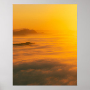 Magical autumn sunrise above clouds poster