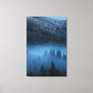 Magical fog over snowy spruce forest canvas print