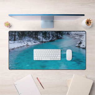 Magical river in enchanted winter forest desk mat