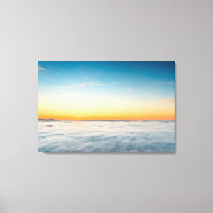 Magical sunrise above clouds canvas print