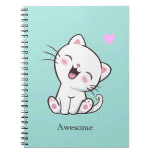 Magnifique chaton mignon sur un cahier sarcelle cl