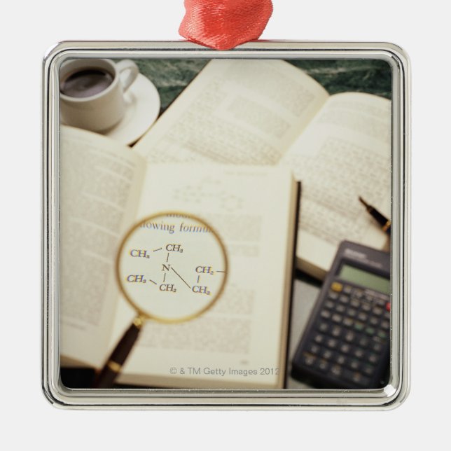 Magnifying glass enlarging molecular diagram metal ornament (Front)