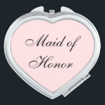 Maid of Honour Compact Mirror<br><div class="desc">Compact mirror shown in a heart shape with a blush pink background colour with Maid of Honour text in black. 
Customize this item or buy as is.</div>