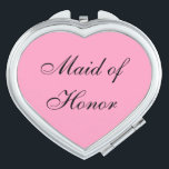 Maid of Honour Compact Mirror<br><div class="desc">Compact mirror shown in a heart shape with a pink background colour with Maid of Honour text in black.
Customize this item or buy as is.</div>