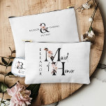 Maid of Honour Flower Letter Boho Floral Custom Accessory Pouch<br><div class="desc">Maid of Honour accessory bag to personalize. Maid of Honour is lettered with neutral boho floral letters and handwritten script. You can also add the name of the bride and groom and their wedding date, which frames a co-ordinating floral ampersand. Lovely wedding party keepsake gift and perfect for a fall...</div>