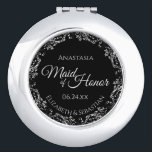 Maid of Honour Wedding Gift Fancy Black & Silver Compact Mirror<br><div class="desc">This compact mirror is designed to give as a gift or favour to the Maid of Honour in your wedding party. It features a simple yet elegant design with a classic black background, script lettering, and a lacy silver floral border. Perfect way to thank her for being a part of...</div>