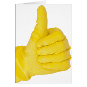 Main dans le gant jaune de latex