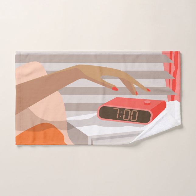 Main des femmes poussant le bouton snooze du révei (Serviette à main)