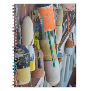 Maine, Bar Harbour. Colourful lobster trap buoys Notebook