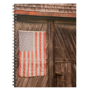 Maine, Faded American flag on door of old barn Notebook