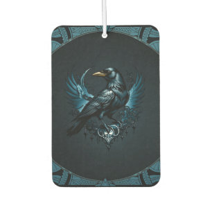 Majestic black raven sitting on an ornate air freshener