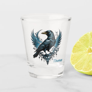 Majestic black raven sitting on an ornate shot glass