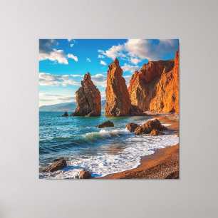 Majestic Coastal Rock Against a Bright Blue Ocean Canvas Print