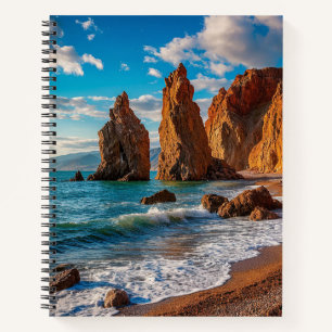 Majestic Coastal Rock Against a Bright Blue Ocean Notebook