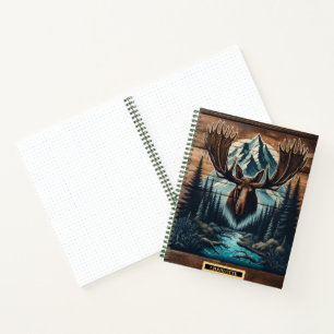 Majestic moose head with mountain backdrop at dusk notebook