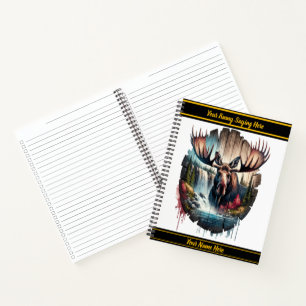 Majestic moose standing near a cascading waterfall notebook
