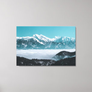 Majestic mountains rising over foggy valley canvas print