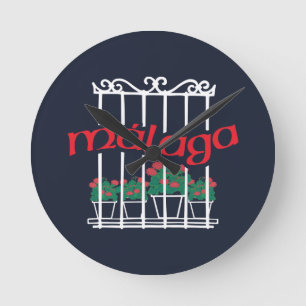 Malaga, window with flowers round clock