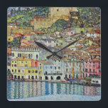 Malcesine on Lake Garda By Gustav Klimt Square Wall Clock<br><div class="desc">Malcesine on Lake Garda (1913) by Gustav Klimt is a vintage Victorian Era Art Nouveau fine art symbolism painting. A beautiful view of the Italian city of Malcesine with buildings and houses on the edge of the harbour. The homes and boats cast a reflection in the calm water. You can...</div>
