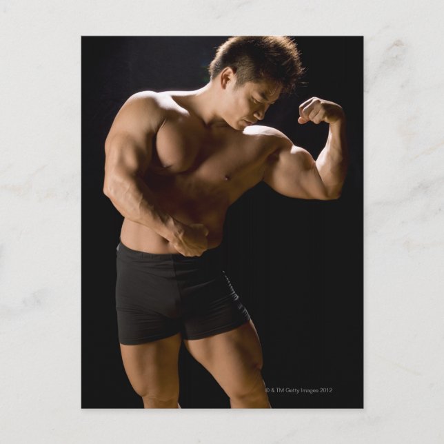 Male bodybuilder flexing muscles, front view, postcard (Front)
