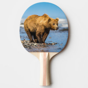 Mama bear watching her two kids ping pong paddle