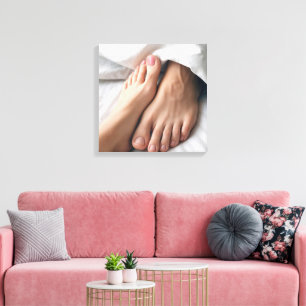Man and a Woman's Foot On a White Bedsheet  Canvas Print