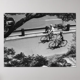 Man and Boy Cycling Poster