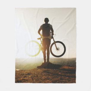 Man carrying bike fleece blanket