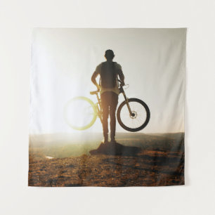 Man carrying bike tapestry