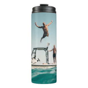 Man diving on pool thermal tumbler