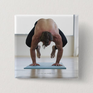 Man doing workout on yoga mat 2 inch square button