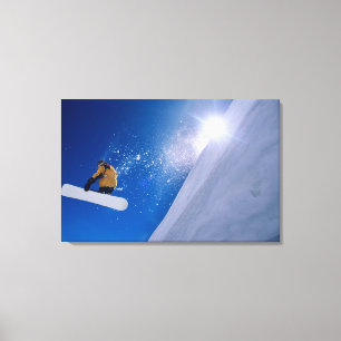 Man flying through the air on a snowboard with canvas print