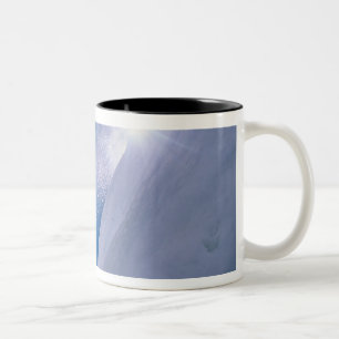 Man flying through the air on a snowboard with Two-Tone coffee mug