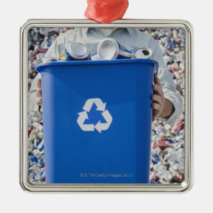 Man holding blue bin metal ornament