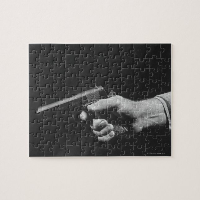 Man Holding Gun Jigsaw Puzzle (Horizontal)