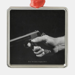 Man Holding Gun Metal Ornament