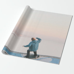 Man in blue skateboarding on wall in beach wrapping paper