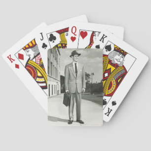 Man in Suit Playing Cards