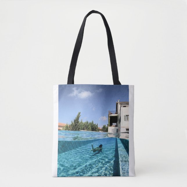 Man in swimming pool in the morning tote bag (Front)