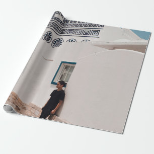 Man lean on concrete house wrapping paper