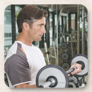 Man lifting weights in gym 2 coaster