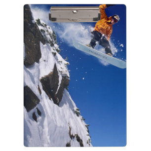 Man on a snowboard jumping off a cornice at clipboard