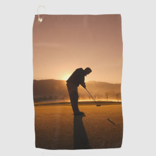 Man playing Golf at sunset Golf towels