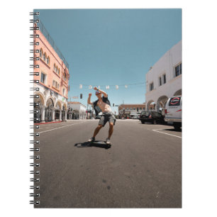 Man playing skateboard notebook
