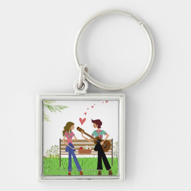 Man playing the guitar with a woman beside her keychain (Front)