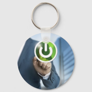 Man pushes power button concept background keychain