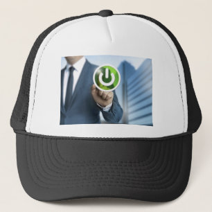 Man pushes power button concept background trucker hat