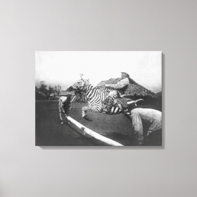 Man Riding Zebra Jumping Fence Photograph Canvas Print (Front)