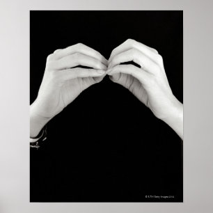 Man signing letter b in British sign language,